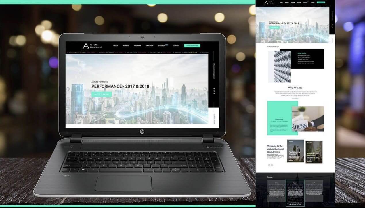 An HP laptop with black, white, and green website design